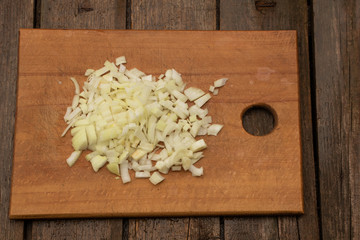 Chopped onion ready to cook. Onion on wooden background
