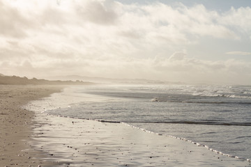 Waves breaking on a remote surf beach, New Zealand. 
