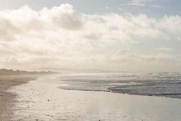 Fototapeta premium Waves breaking on a remote surf beach, New Zealand. 