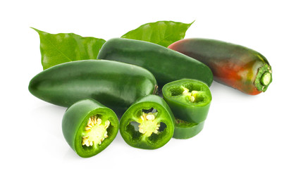 sliced green jalapeno peppers on white background