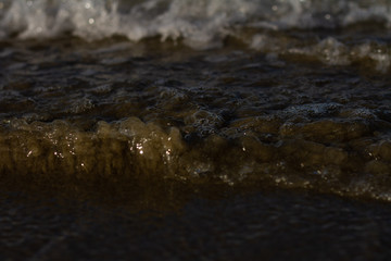 Waves breaking on a remote surf beach, New Zealand. 