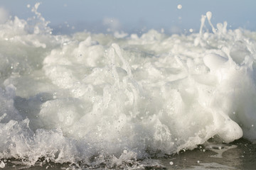 Waves breaking on a remote surf beach, New Zealand. 