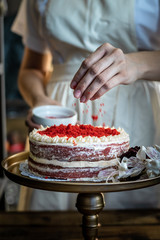 hands of the girl with cake