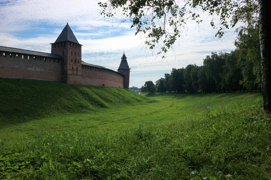 View to the wall and towers of the Velikiy (Great) Novgorod citadel (kremlin, detinets) in Russia under blue summer sky in the morning 