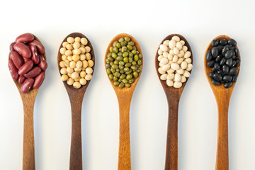 Collection of whole grains seeds isolated on white background. Healthy diet raw ingredients.