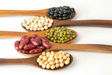 Collection of whole grains seeds isolated on white background. Healthy diet raw ingredients.