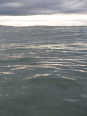 Fototapeta na wymiar Small waves breaking on a surf beach, New Zealand. 