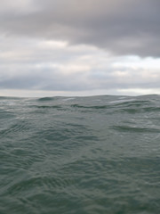 Naklejka na ściany i meble Small waves breaking on a surf beach, New Zealand. 