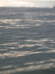 Small waves breaking on a surf beach, New Zealand. 