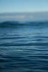 Small waves breaking on a surf beach, New Zealand. 