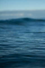 Small waves breaking on a surf beach, New Zealand. 