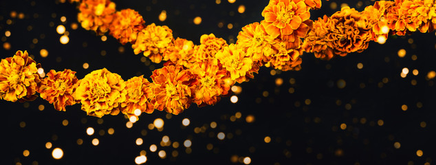 Marigold flowers Garlands on black. Dia de los muertos day, day of the dead or halloween banner,...