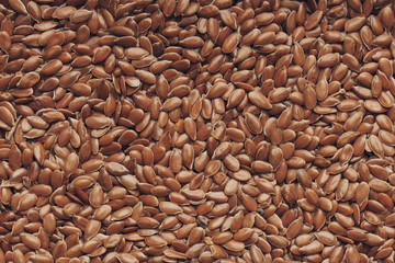 Flax seeds background texture . Macro shot.