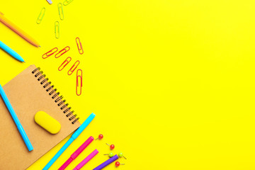 Set of school stationery on color background