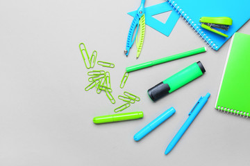 Set of school stationery on grey background