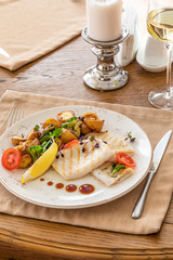 grilled squid with a side dish in the interior