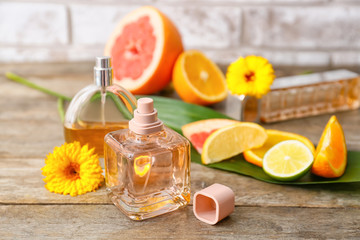 Composition with floral and citrus perfumes on table