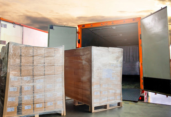 Cargo freight, Shipment, Delivery service. Warehouse docks. Stacked package boxes on pallet waiting...