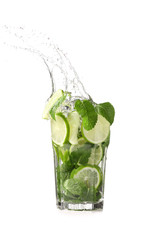 Glass of fresh mojito with splash on white background