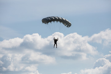 City Riga, Latvian republic. Parachutists land with parachutes on target.