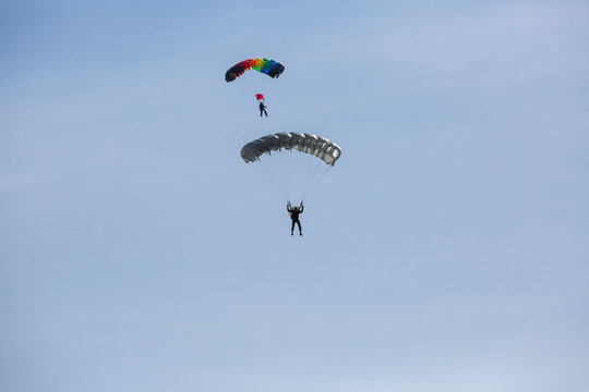 City Riga, Latvian republic. Parachutists land with parachutes on target.