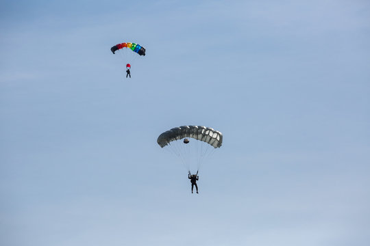 City Riga, Latvian republic. Parachutists land with parachutes on target.