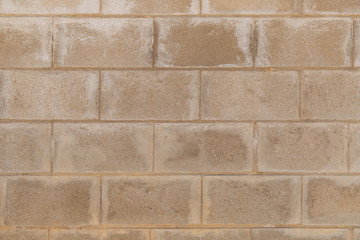 Weathered stained brown brick wall. Textured. Background