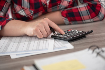 Woman using calculator