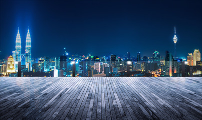 Fototapeta na wymiar Rooftop balcony with night view cityscape background
