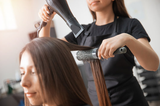 Close-up of hair dryer and brush, concept cut salon female stylist