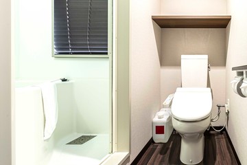 Modern automatic toilet In a small toilet in a wooden house