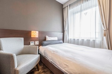 Single bed in modern small bedroom at apartment