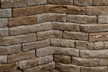 Gray stone wall made of natural stone