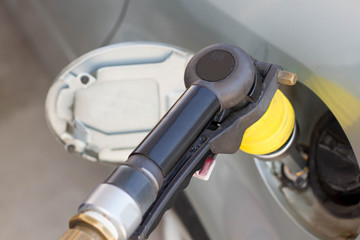 LPG car gas pump nozzle connected to the car's fuel tank. Alternative fuel options.