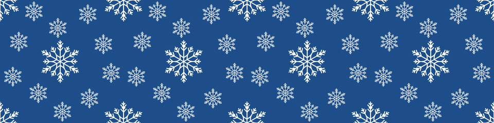 Fototapeta na wymiar Christmas seamless pattern with snowflakes on pastel blue background. Winter background with snowfall. Endless Christmas Pattern. extra wide banner background