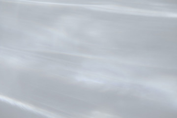 Obraz premium Water texture overlay effect for photo and mockups. Organic drop diagonal shadow and light caustic effect on a white wall. Shadows for natural light effects