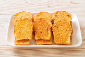 baked crispy bread with butter and sugar