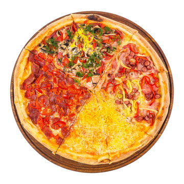pizza with four different type of toppings. tasty quadruple italian family food on the round wooden board. isolated on the white background. top view