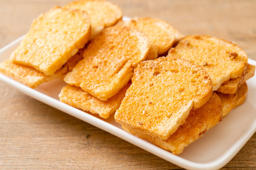 baked crispy bread with butter and sugar