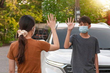 Asian man and women shake hand no touching to protect corona virus concept new normal social...