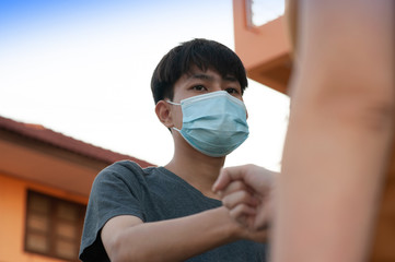 Asian man and women shake hand no touching to protect corona virus concept new normal social...