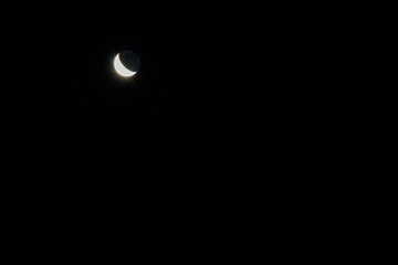 Crescent moon in dark night sky