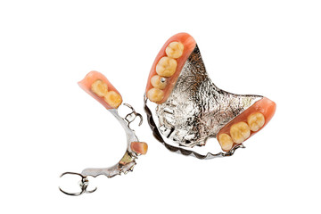 Top view of removable dentures lower and upper on white background.