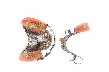 Top view of removable dentures both upper and lower on white background.