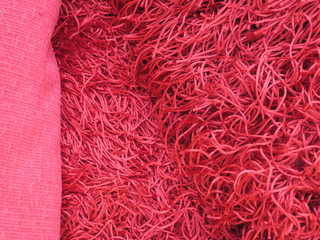 close-up of a red colored high pile carpet