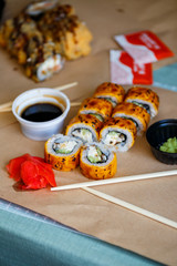 A set of sushi from many types of roles and with different stuffing. Sushi menu. Japanese gourmet sushi.