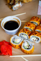 A set of sushi from many types of roles and with different stuffing. Sushi menu. Japanese gourmet sushi.