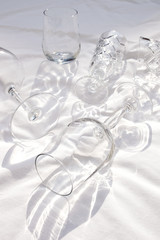 Translucent Glasses on a White Linen Sheet, Covered in Sunlight