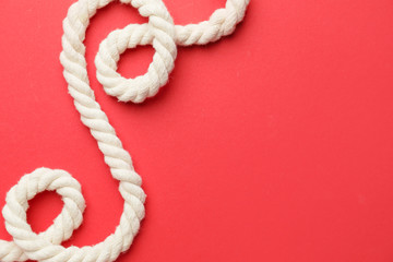 Long rope on color background
