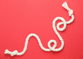 Long rope on color background